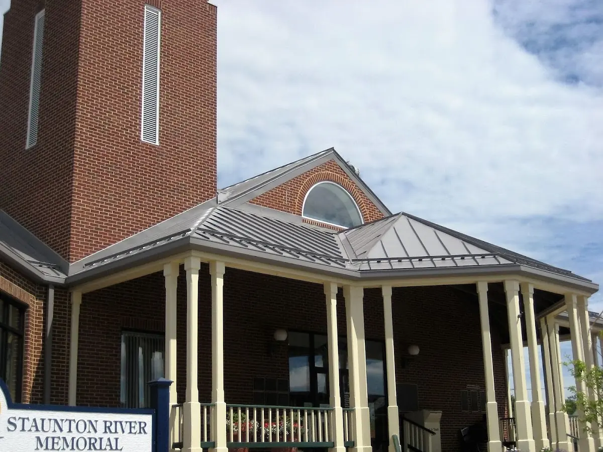 Skilled roofing craftsmen working on a residential roof in Bourbonnais